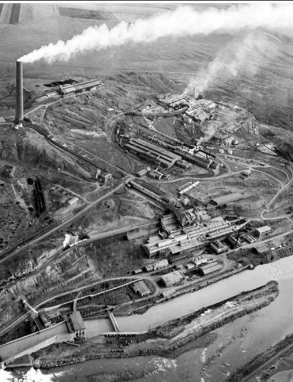 Aerial photograph of the sprawling Washoe smelter complex with smoke streaming from its stacks